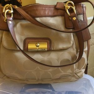 taupe Signature Coach purse. Like new!Flawless !